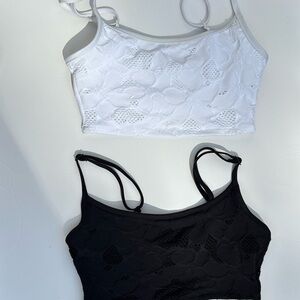 Set of bathing suit tops. One white, one Black.